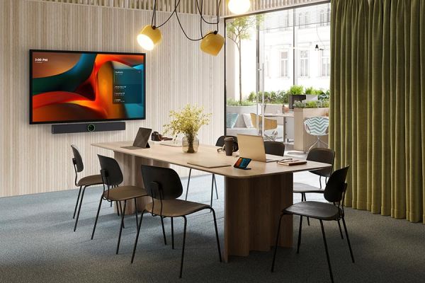 Modern conference room with a large screen and table